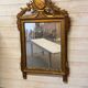 Neoclassical mirror in gilded wood