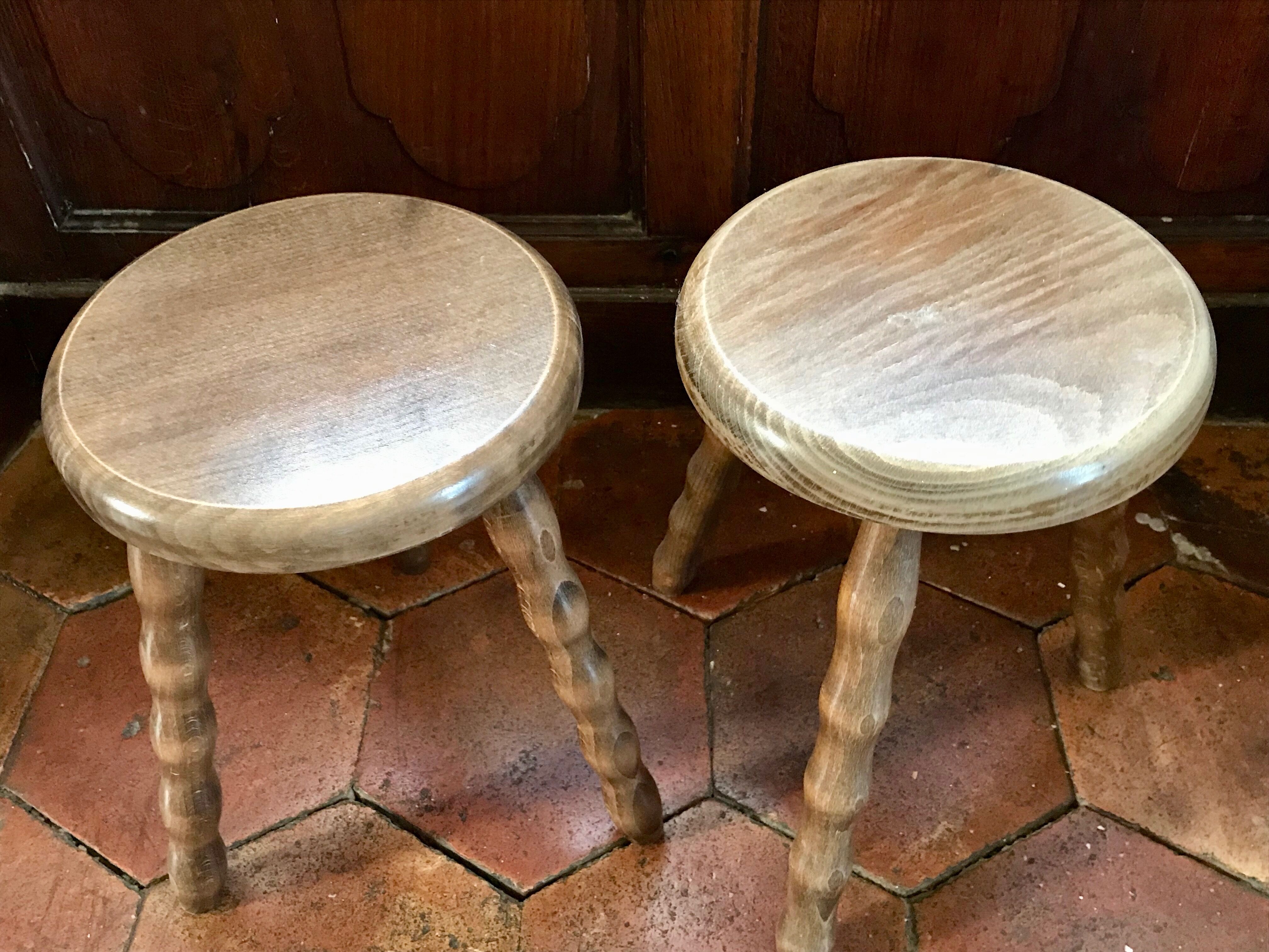 2 wooden tripod stool