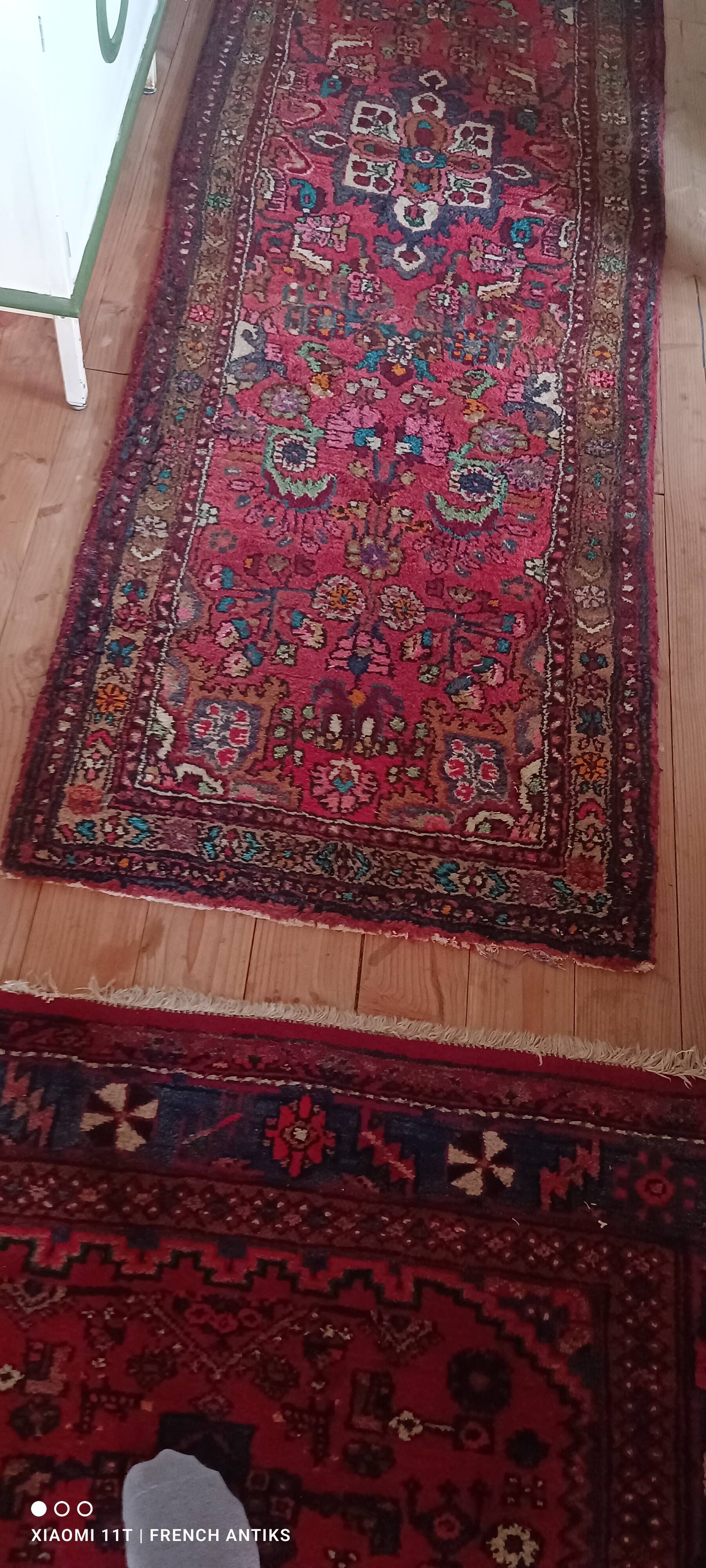 Vintage oriental rug from the 1930s. Handcrafted, handmade. Worn.