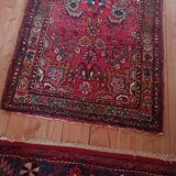 Vintage oriental rug from the 1930s. Handcrafted, handmade. Worn.
