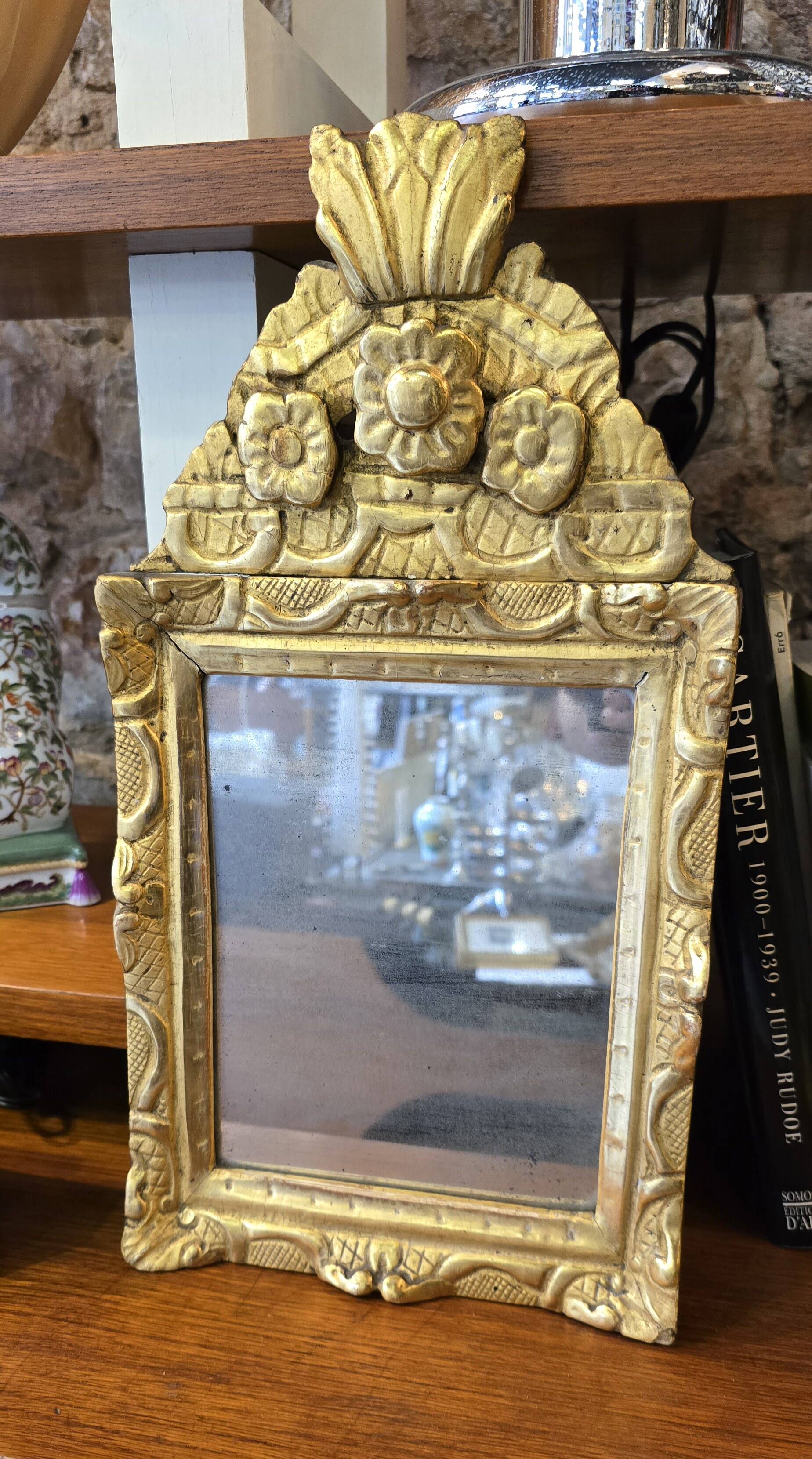 Small Louis XIV mirror in gilded carved wood from the early 18th century.