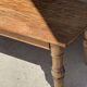 Brown Indonesian teak coffee table, with a border and cylindrical legs H40 L103.