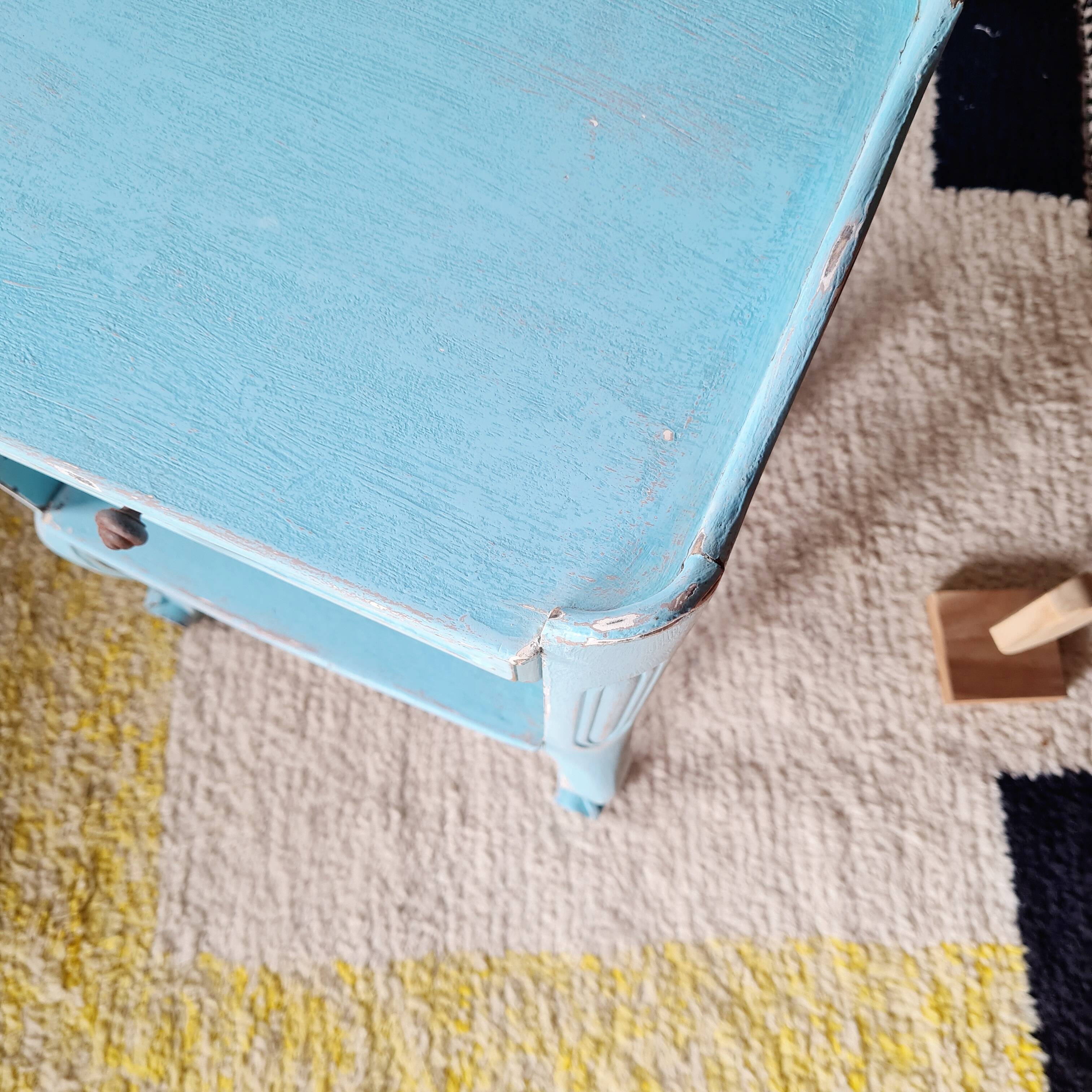 Small vintage bedside table in azure blue patina.