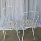 Pair of antique garden chairs, wrought iron, white paint.