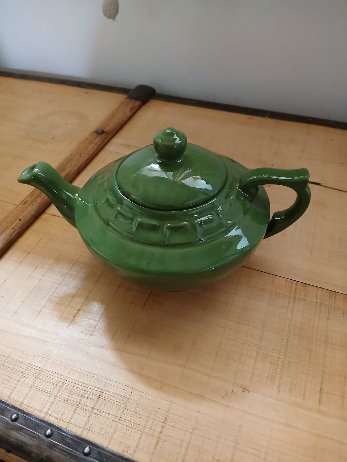 Green earthenware teapot