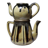 A pair of small vintage teapots in the Art Deco style reminiscent of Denbac.