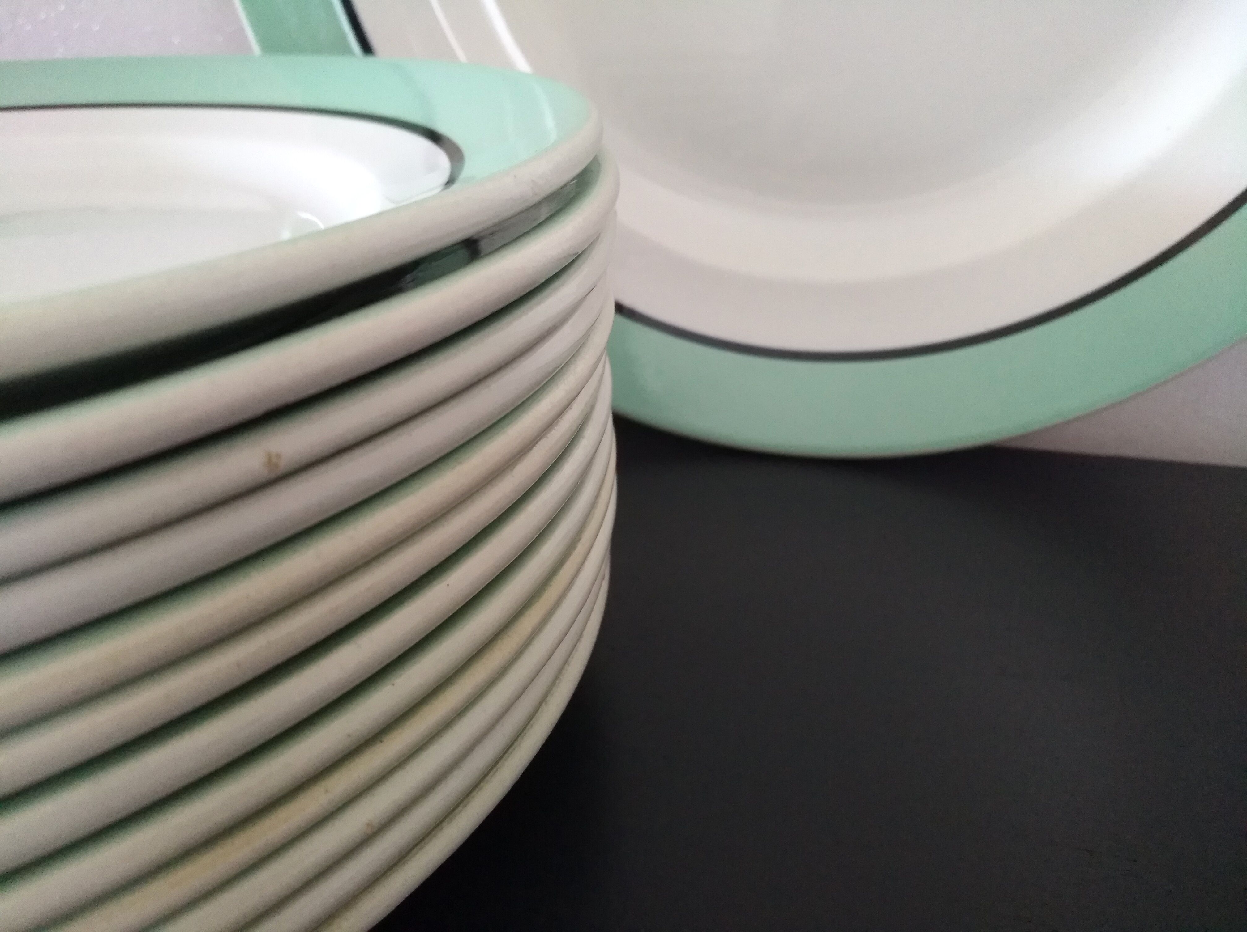 12 service plates and 1 green plate mint