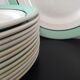 12 service plates and 1 green plate mint