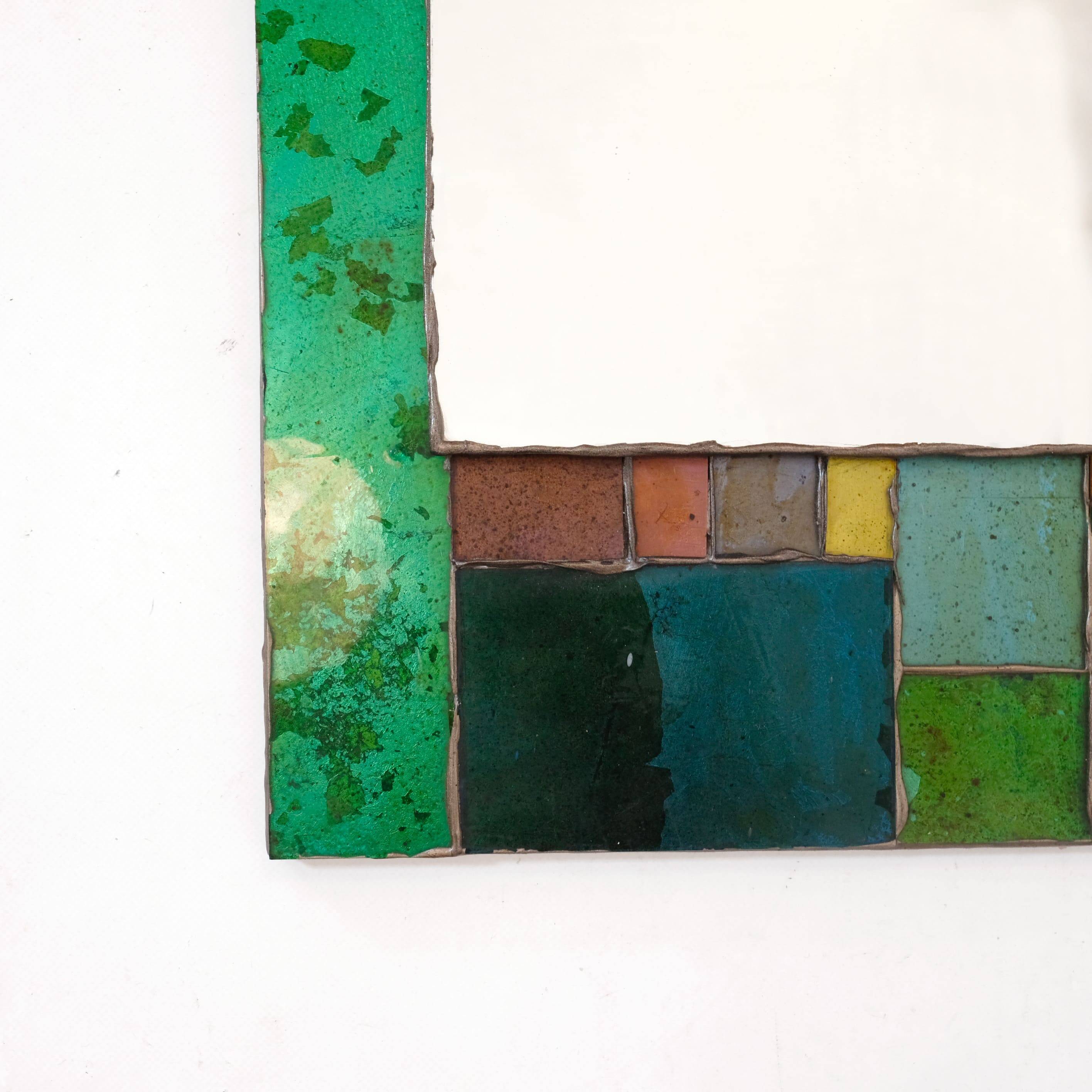 Coloured glass mirror, French work from the 1960s, 35x77 cm.