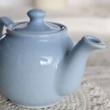 Small vintage sky-blue earthenware teapot