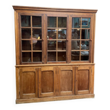 Meuble vitrine de magasin ancien en chêne