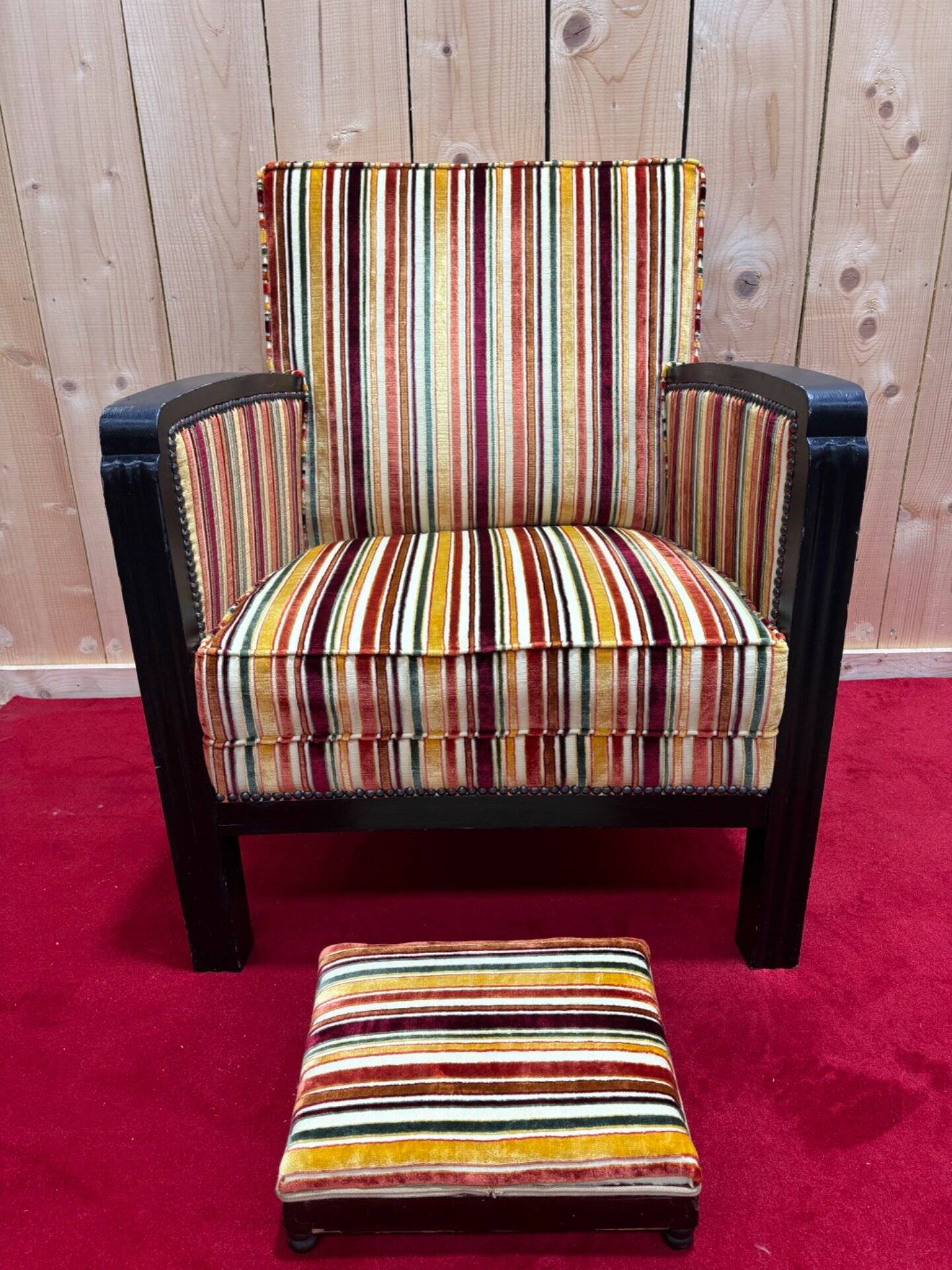 Art Deco armchair in multicolored striped fabric and its footrest