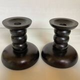 Pair of black stained wooden candlesticks