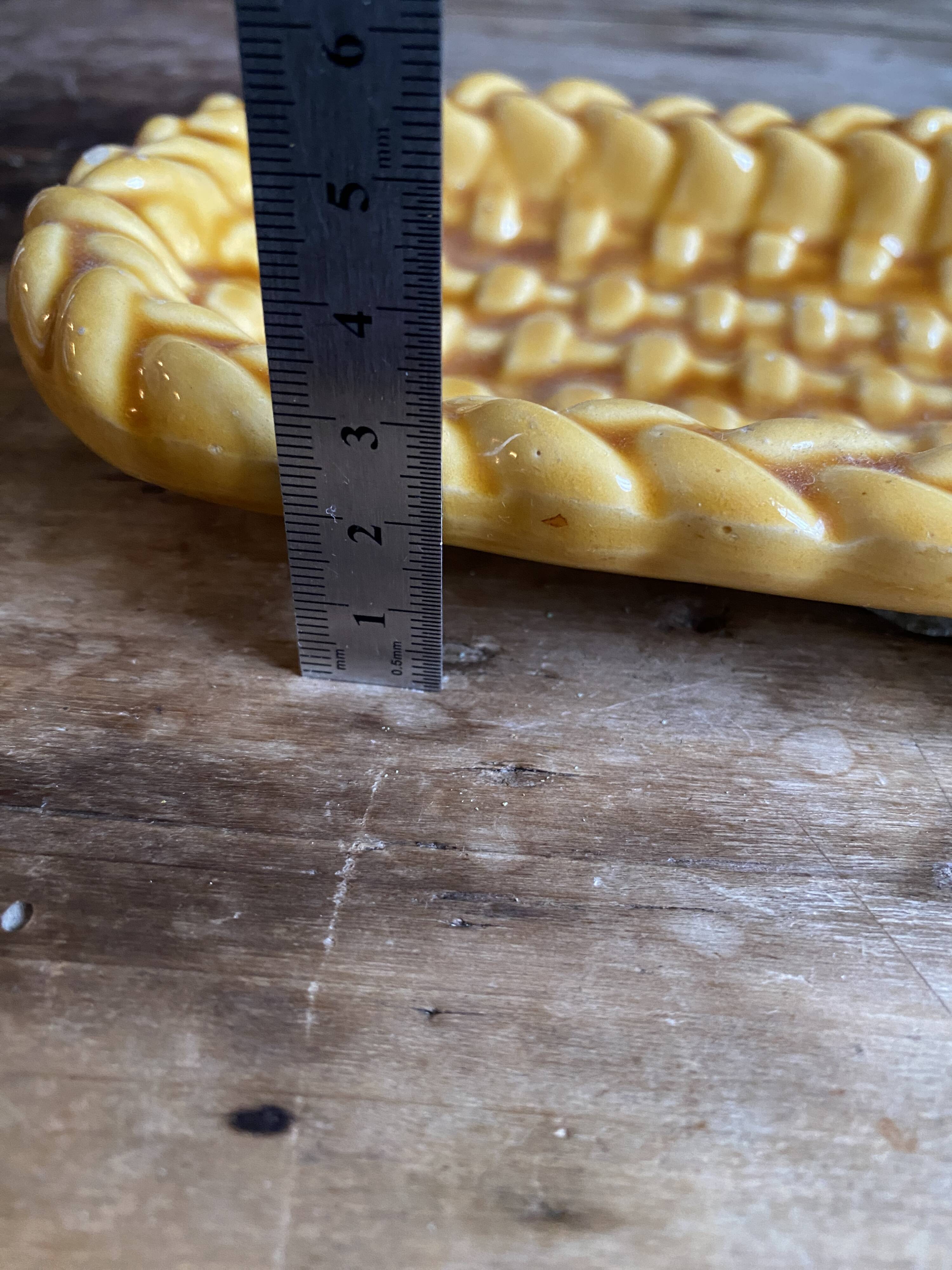 Mustard braided slip pocket emptier