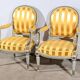 Pair of Cabriolet Armchairs, in rechampi wood, Louis XVI style – Late 19th century