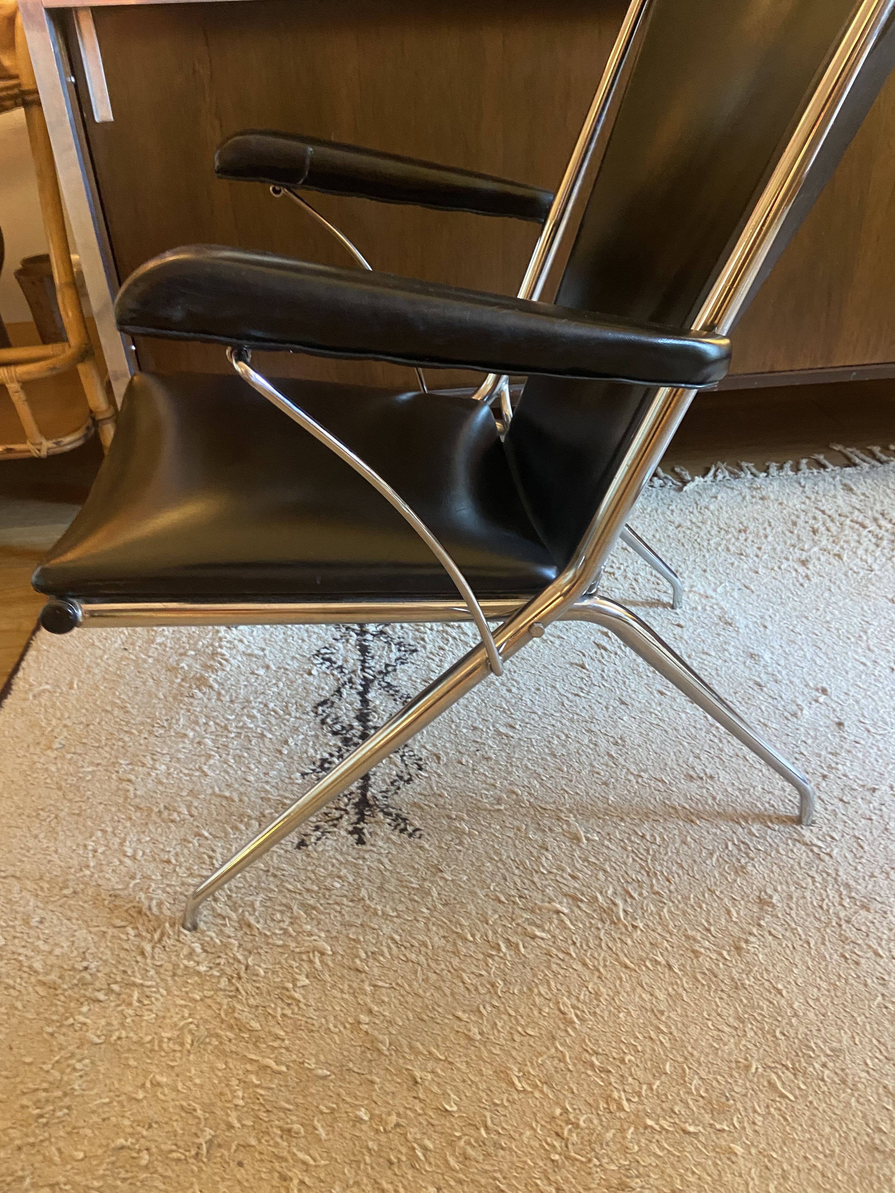 Metal armchair and black skaï