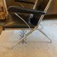 Metal armchair and black skaï