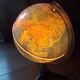 Bright vintage Earth globe brand Vulliermes with metal tripod foot