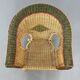 Cabriolet style armchair in rattan, wicker and green and red edging