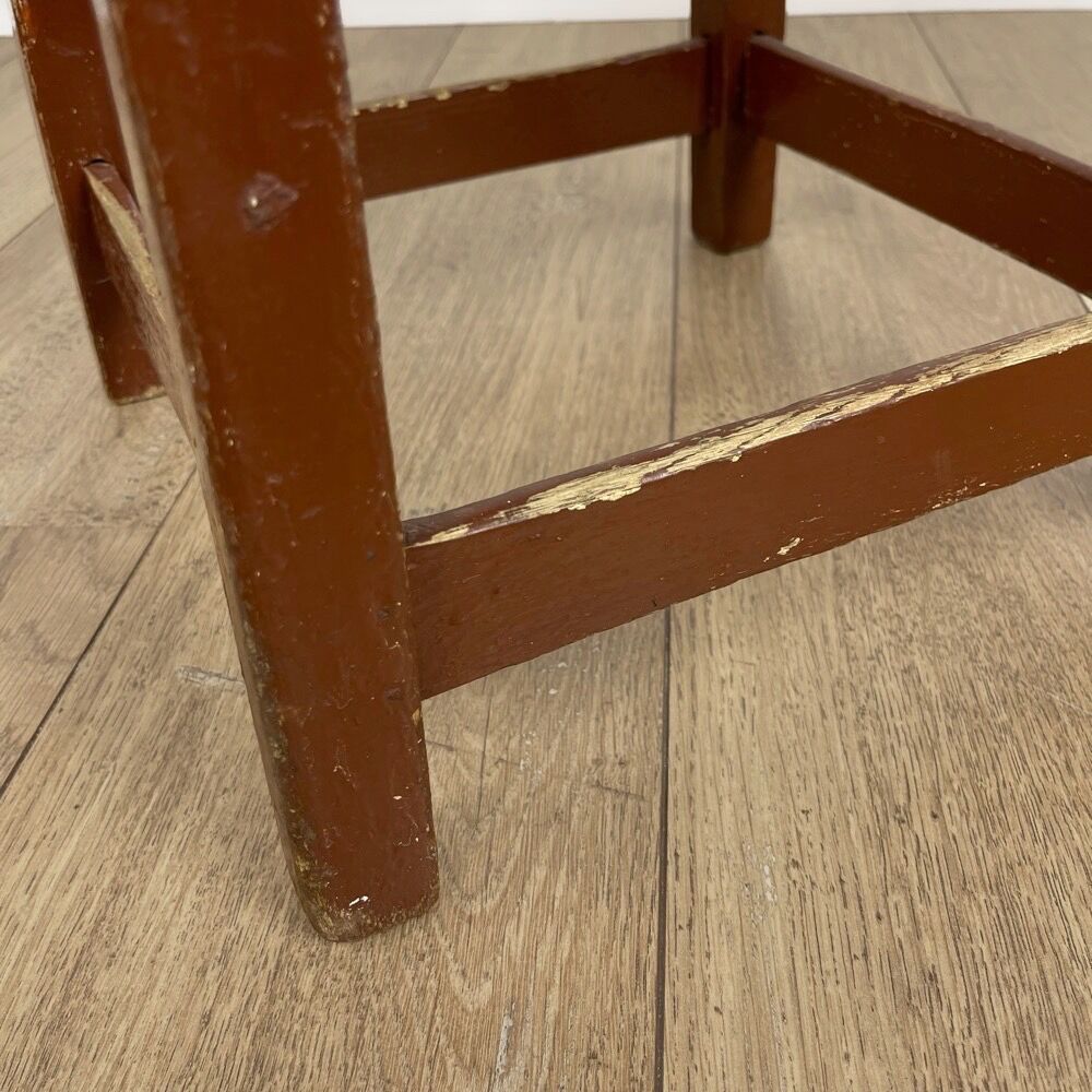 Old solid chocolate wooden stool