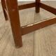 Old solid chocolate wooden stool