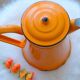 Old orange enamel coffee maker