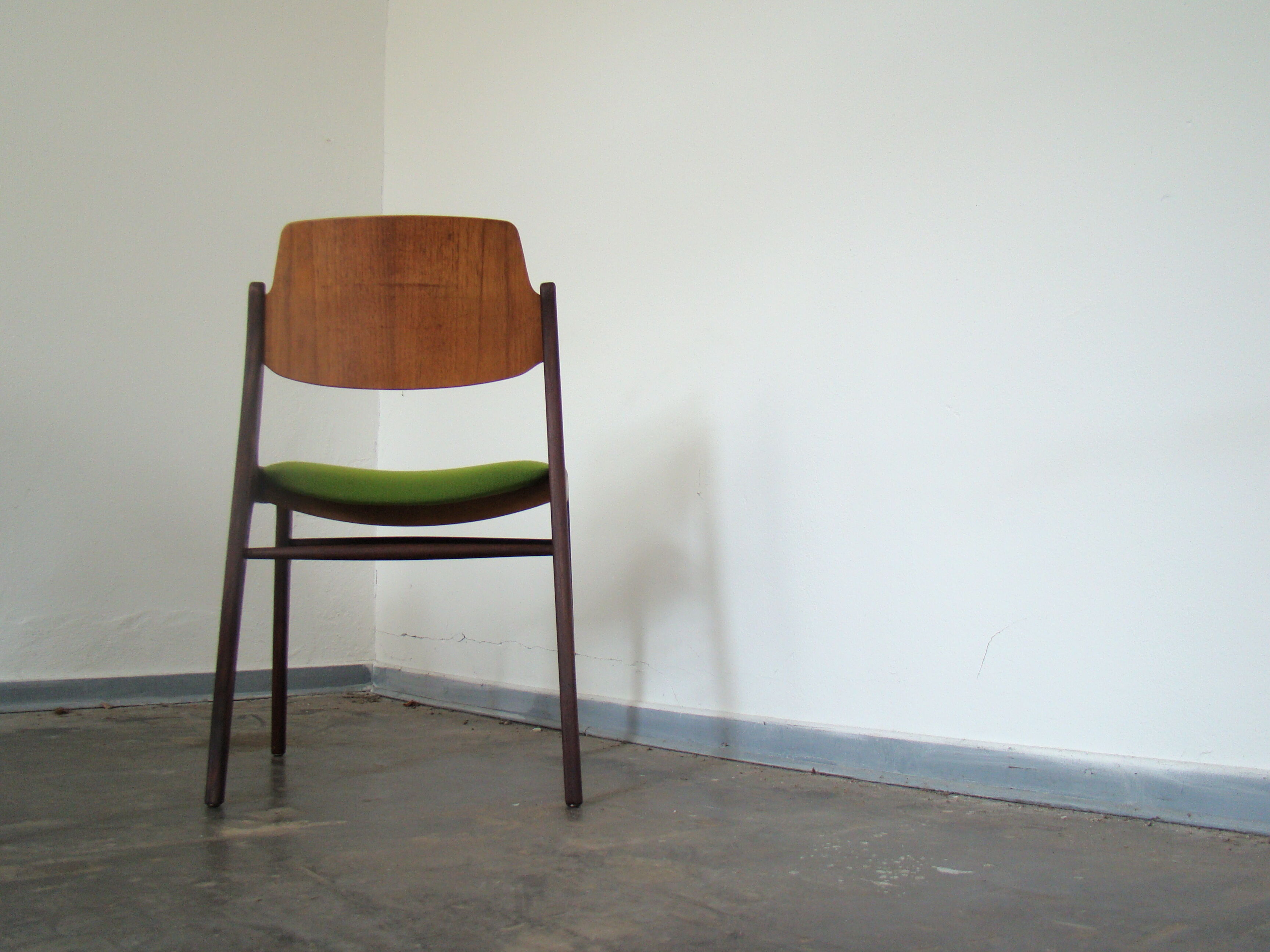 Two vintage teak dining chairs