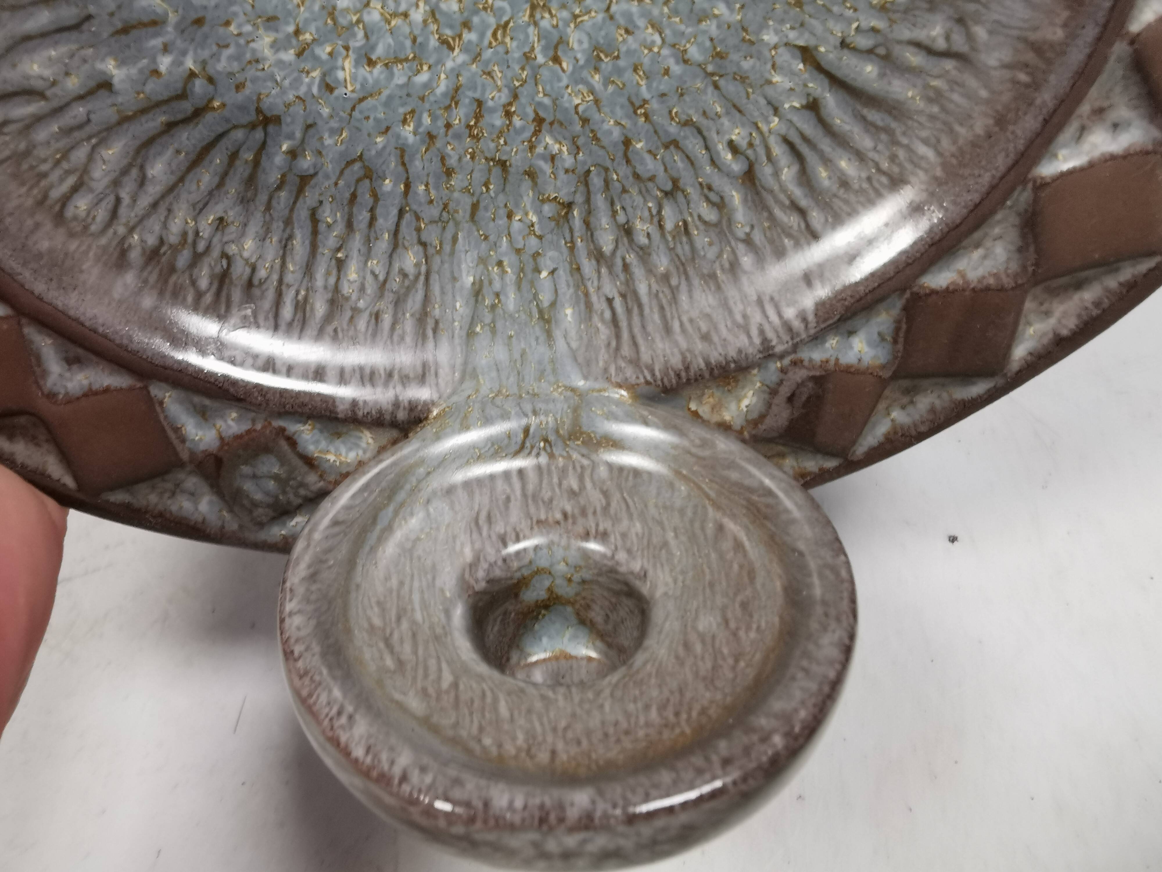 Wall-mounted candlestick in grayish colors, Danish and from the 1970s-80s.