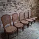 Set of 6 antique Louis XVI style dining chairs with caning.