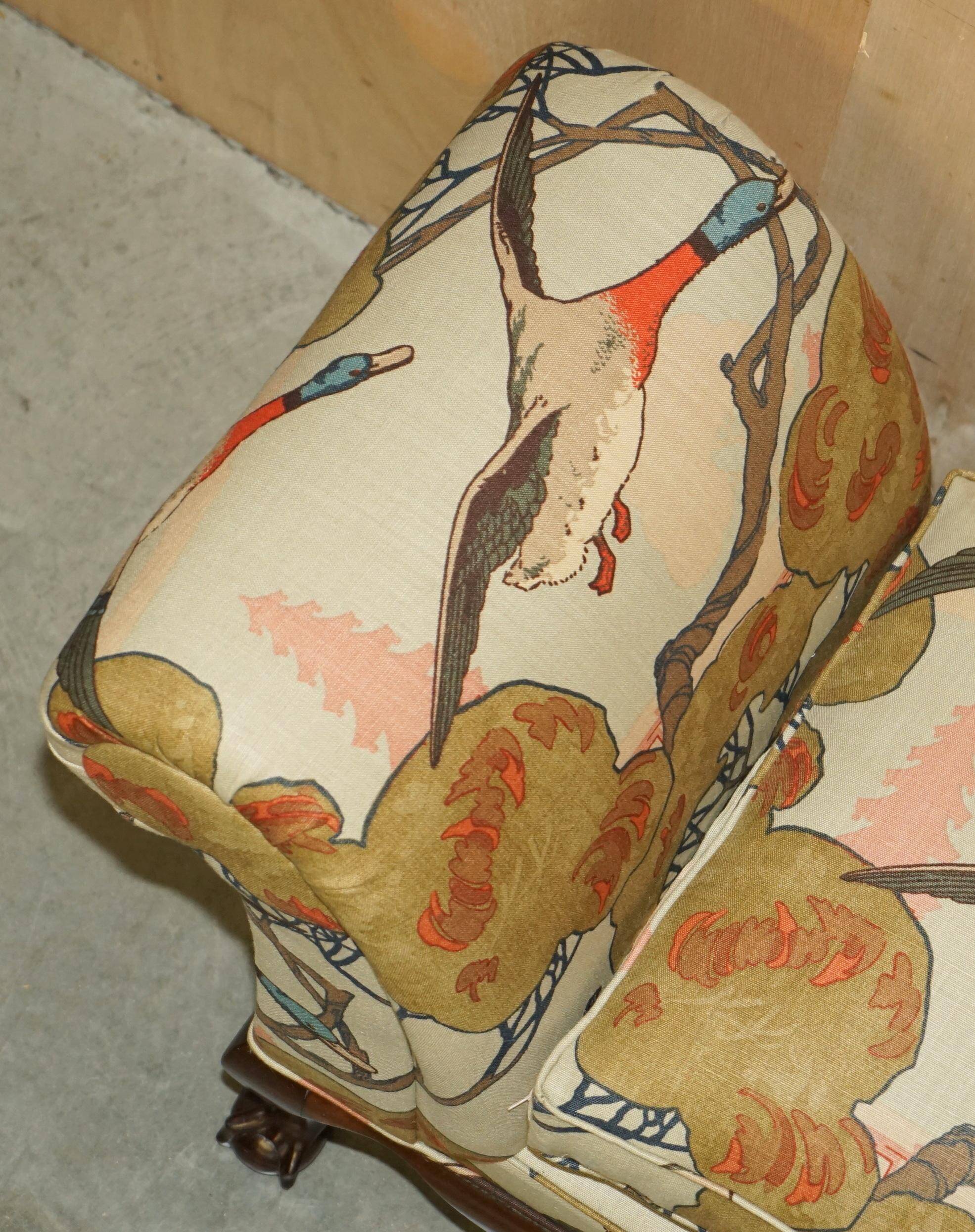 Antique banquette with cluster and ball feet, window seat in Mulberry Flying Ducks fabric.