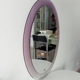 Vintage oval plexiglass mirror from the 70s by Harvey Guzzini