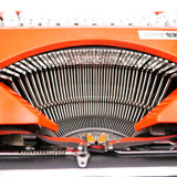 Machine à écrire hermes baby orange corail cursive révisée ruban neuf