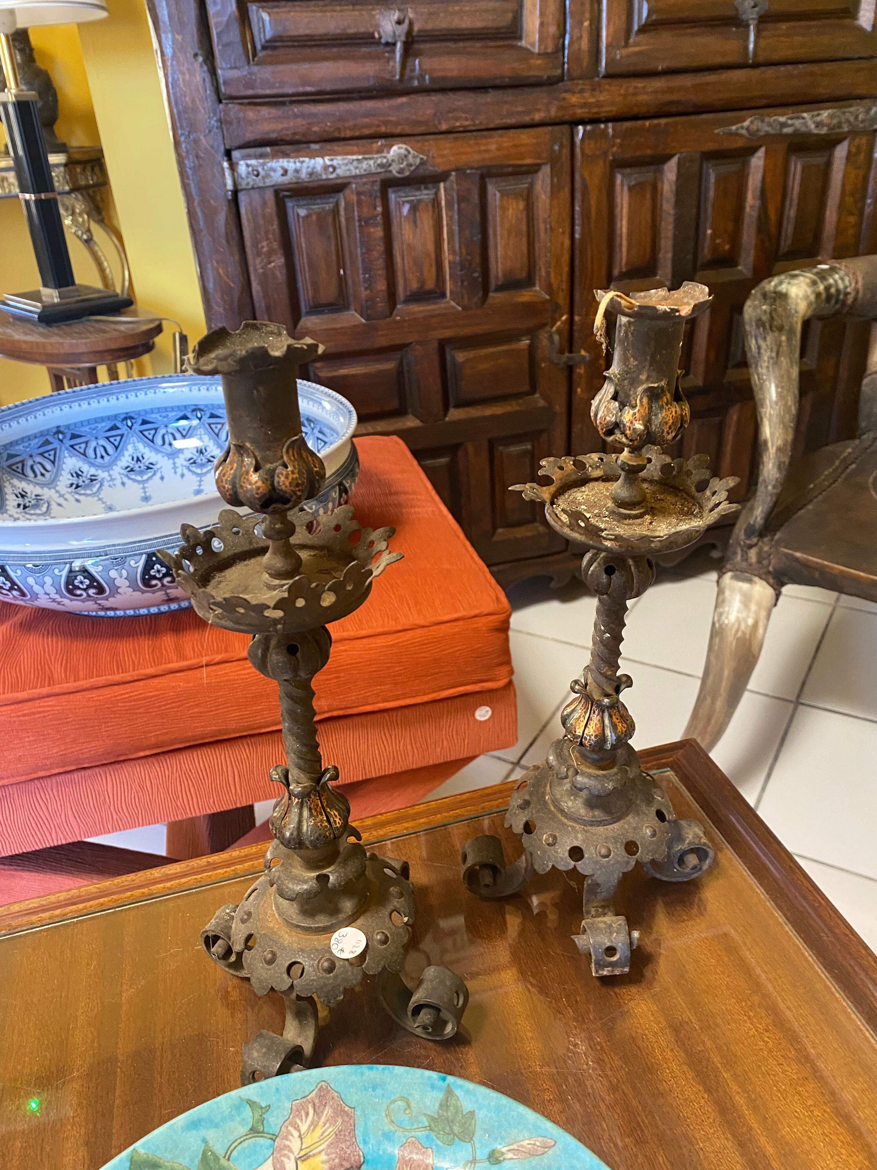Pair of neo-gothic metal candle holders