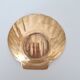 Shell-shaped brass catchall.