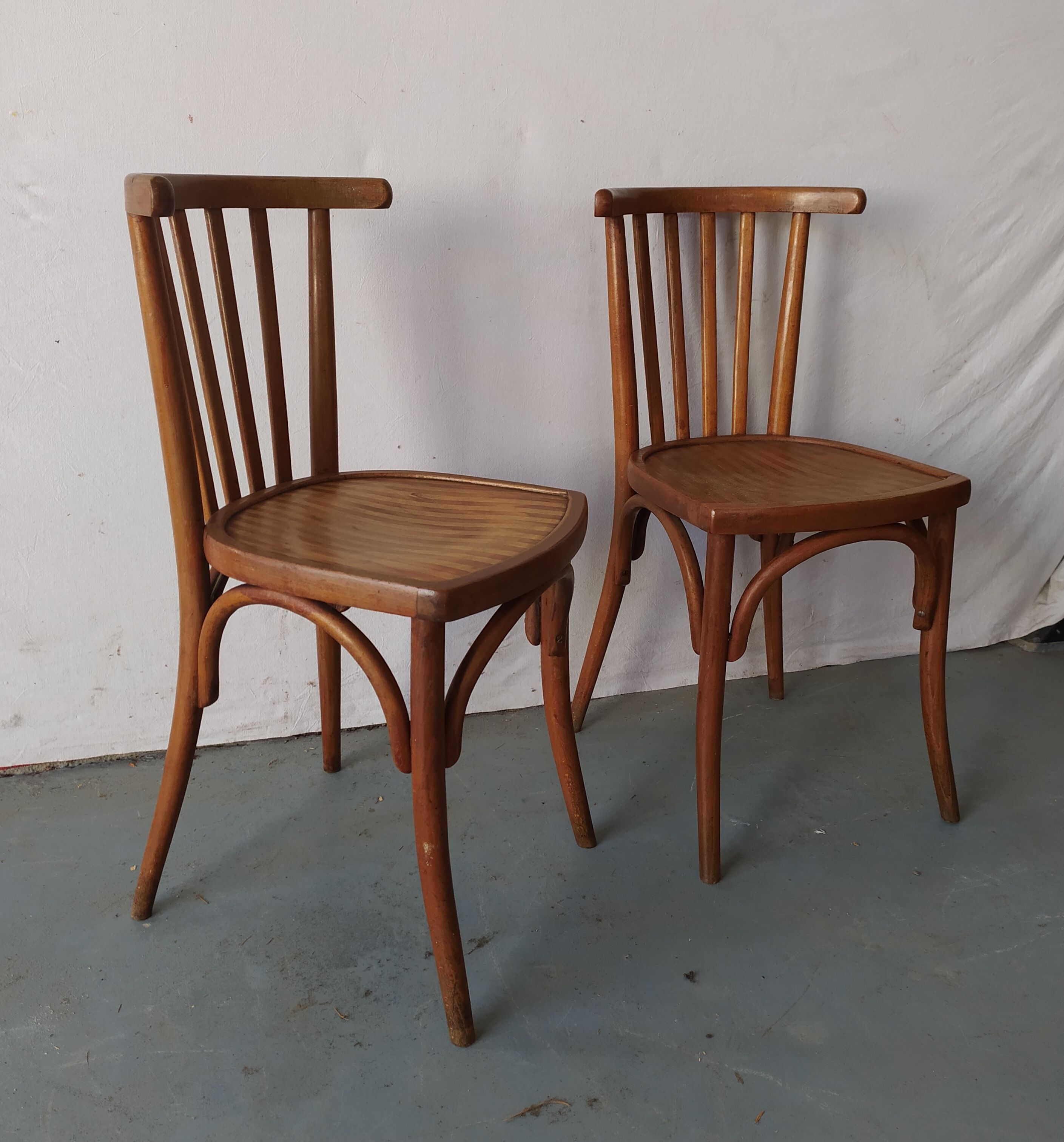 Pair of luterma curved wood bistro chairs