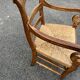 Louis Philippe country armchair in solid wood and straw, hooked armrests