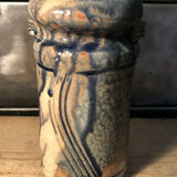 Enamelled pottery vase signed