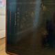 Beautiful vintage Chinese trunk in wicker, black and gold lacquered wood, and brass.