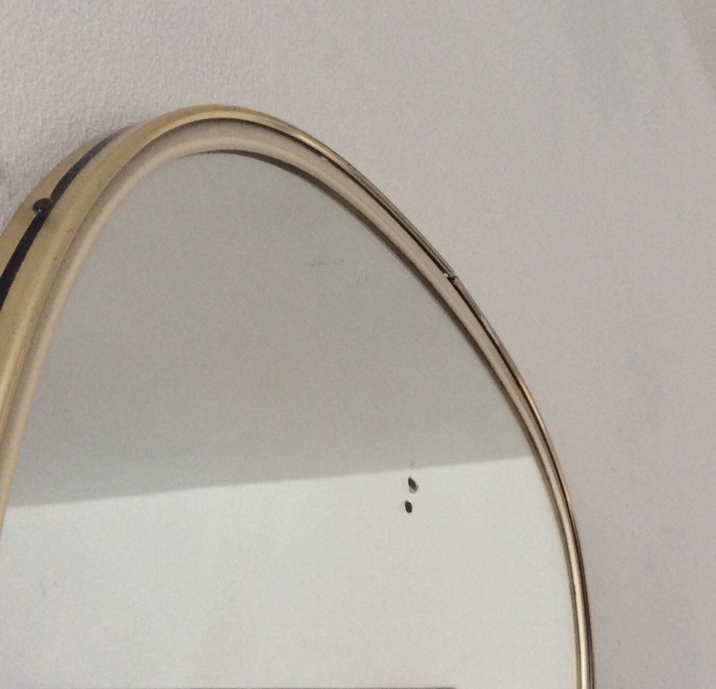 Asymmetrical free-form mirror from the 70s