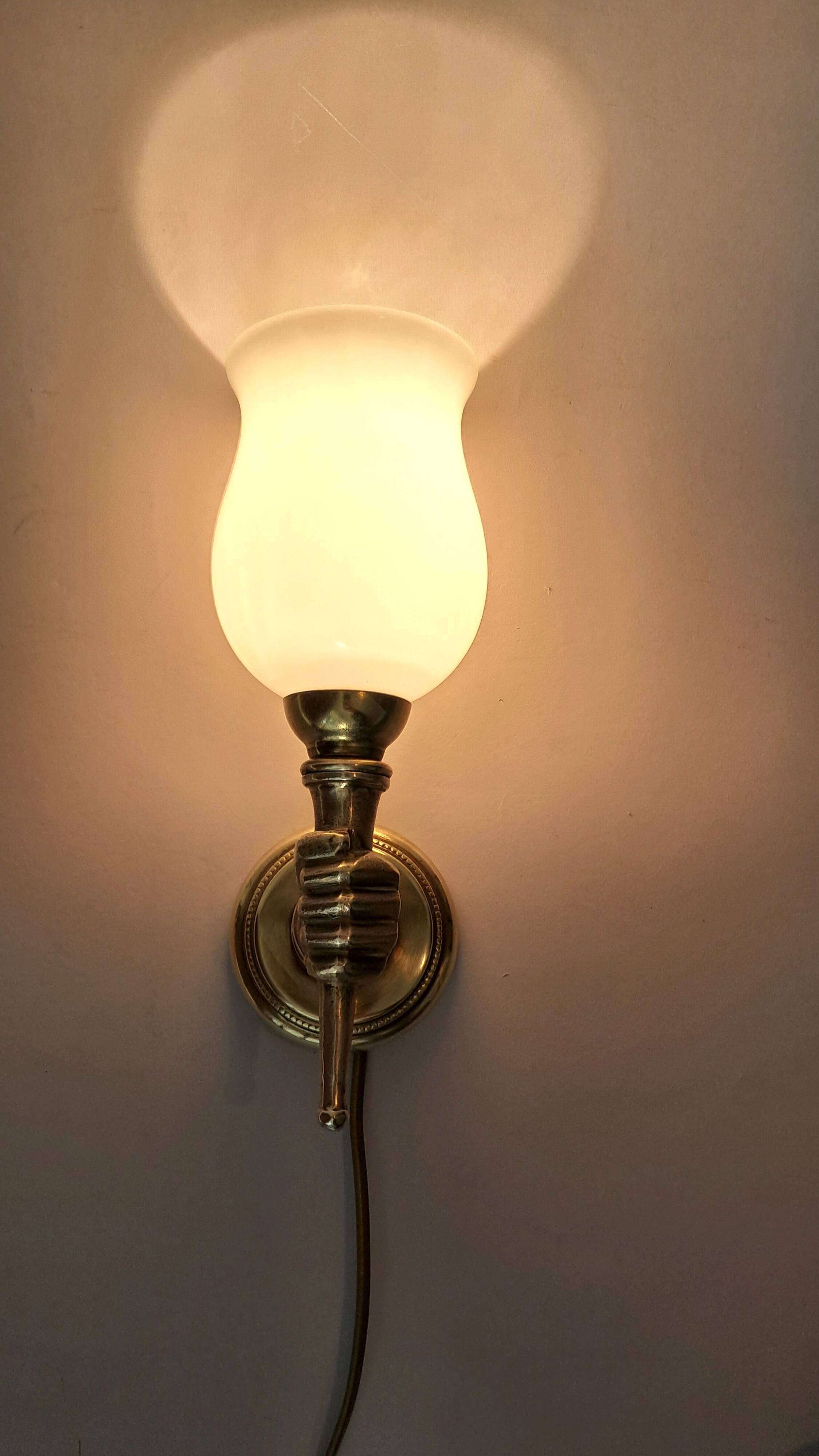 Golden brass wall light from the 1950s.