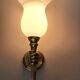 Golden brass wall light from the 1950s.