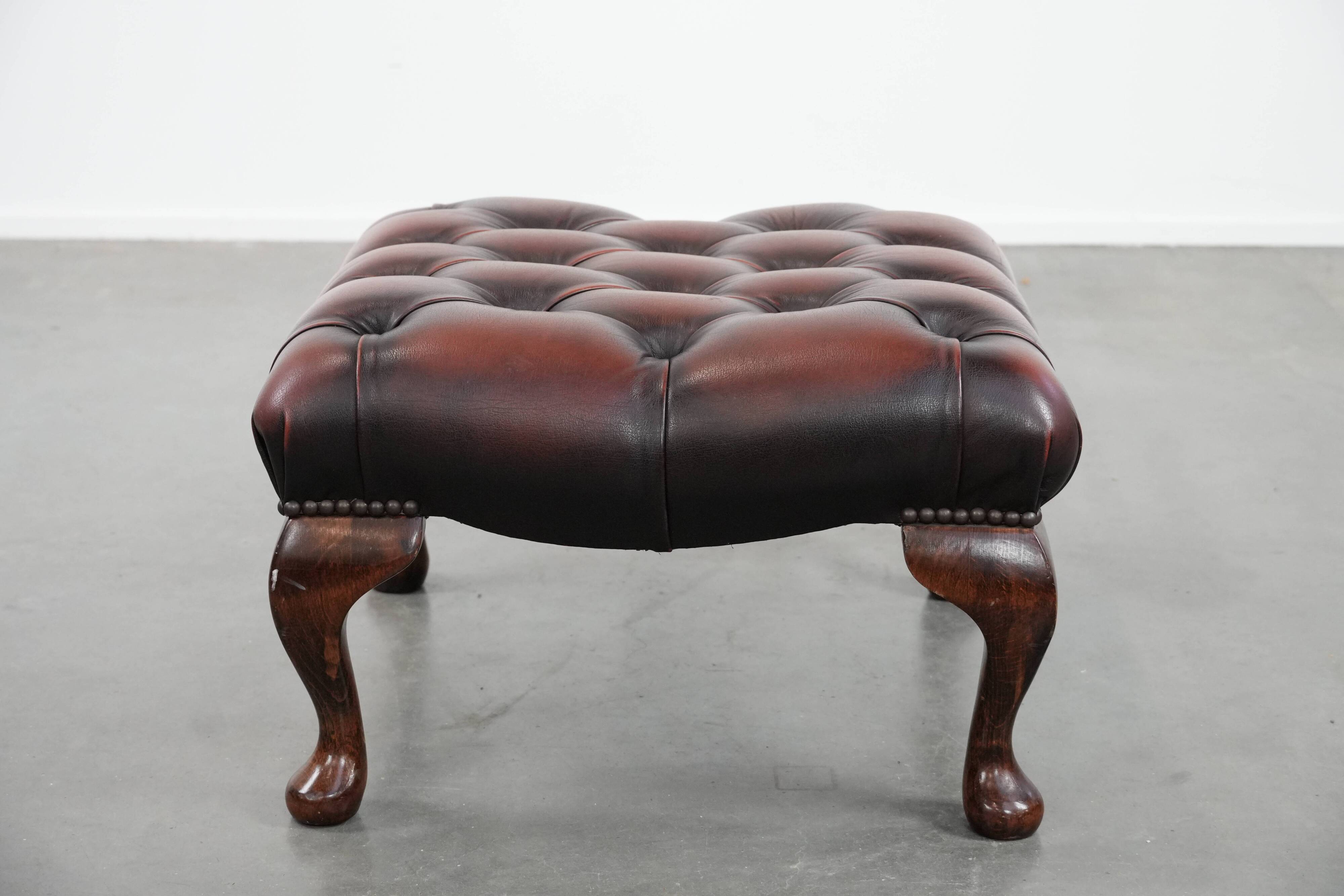 Dark brown chesterfield ottoman in cowhide leather