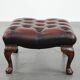 Dark brown chesterfield ottoman in cowhide leather