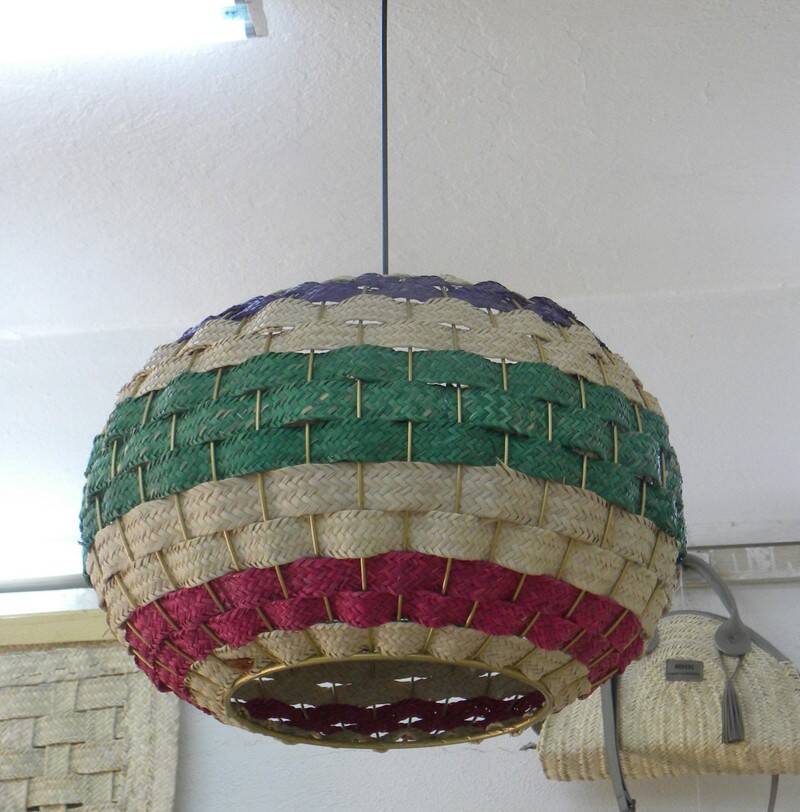 Handmade suspension in coloured woven natural plant fibres.