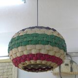 Handmade suspension in coloured woven natural plant fibres.
