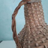 Bottle in his suit of wicker