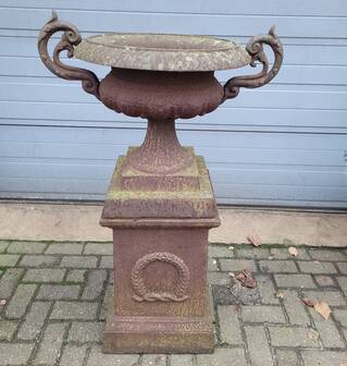 Cast iron garden urn on pedestal with handles