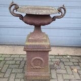 Cast iron garden urn on pedestal with handles