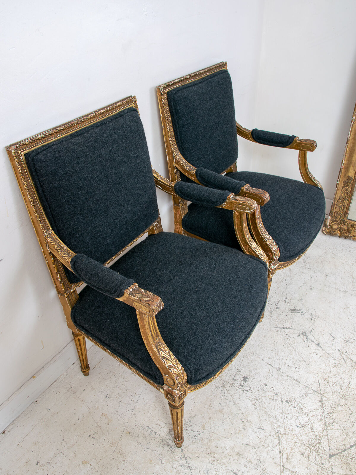 Pair of 19th century Louis XVI gilt armchairs newly re upholstered in holland and sherry fabric