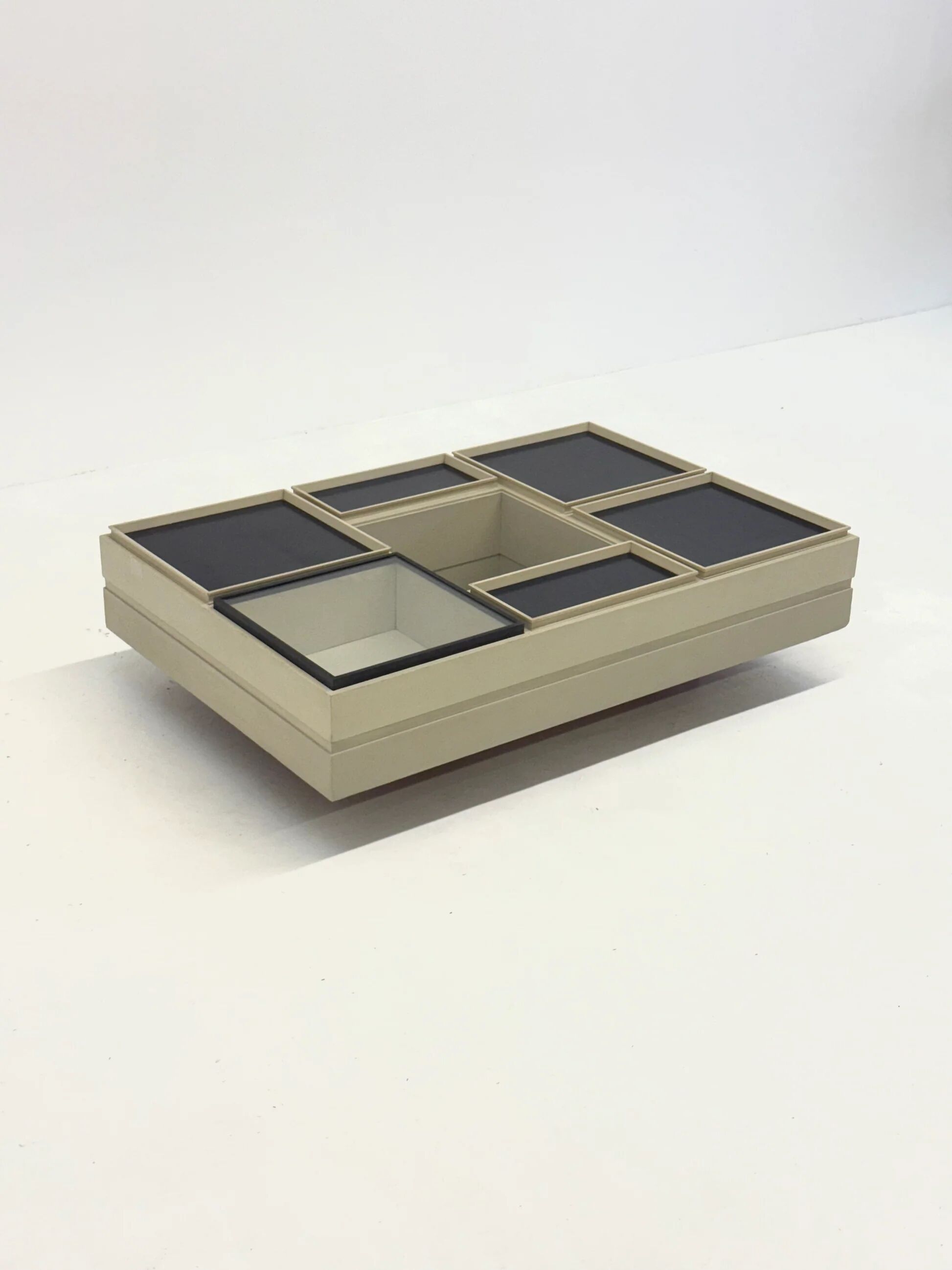 Modular white coffee table designed by Carlo Hauner for Forma